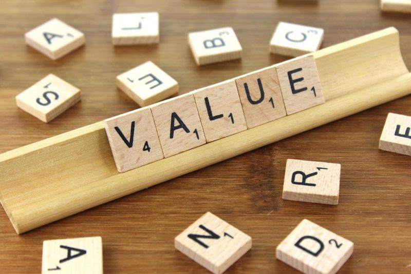 Scrabble tiles spelling VALUE